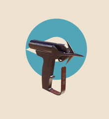 a gun that says ' stainless steel ' on it is against a blue circle