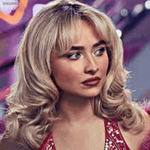 a woman with blonde hair and a red dress has the hashtag brinasdaily at the bottom