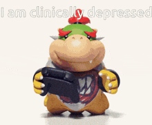bowser is holding a video game controller with the words i am clinically depressed behind him