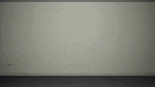 a bowling ball with a face on it is flying in front of a white wall