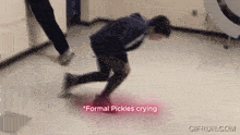 a man is crawling on the floor with the words " formal pickles crying " on the bottom