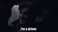 a man says " i 'm a driver " in the dark