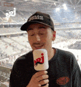 a man wearing a hat that says hello world on it