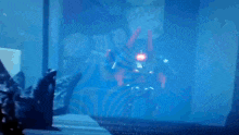 a blurry picture of a robot with a red light on it 's face .