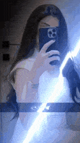 a woman is taking a picture of herself with her phone