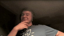 a man wearing headphones and a fox shirt