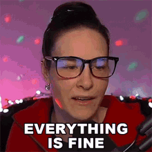 a woman wearing glasses and a red jacket says " everything is fine "