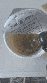 a cup of soup with a label that says ' no. 20 ' on it