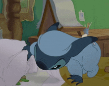 a cartoon of stitch laying on a bed with a frog behind him