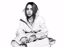 a black and white photo of billie eilish with a green spider in the background