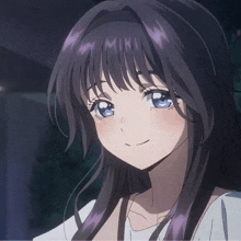 a girl with purple hair and blue eyes is smiling for the camera