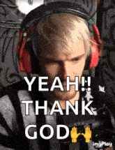 a man wearing headphones says yeah ! thank god