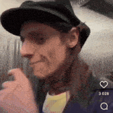a man wearing a hat with a star on it has a heart next to him