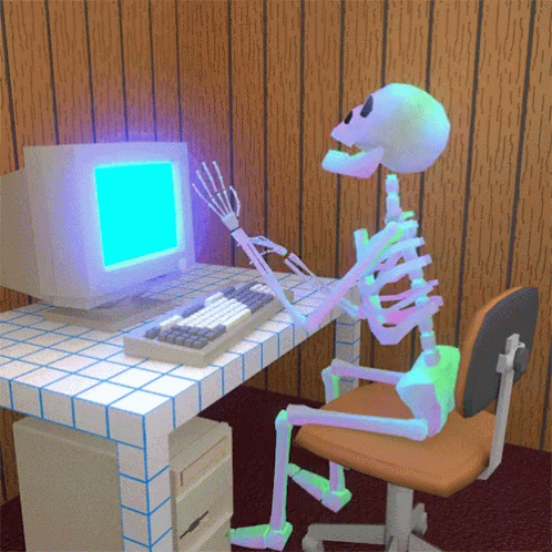 Animated skeleton sitting at a desk with a vintage computer setup