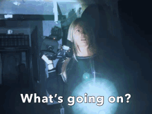 a woman holding a flashlight with the words what 's going on
