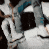 a blurry picture of a person 's legs and feet with a blue circle in the middle
