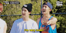 a man says i 'm very loser while standing next to another man on a basketball court