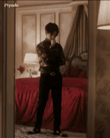 a man standing in front of a mirror with the word piyada on the bottom