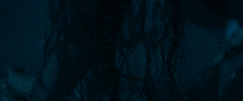 a dark blue background with a few lines of light coming out of it