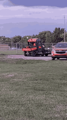 a car is towing a vehicle that says ' chevrolet ' on the back