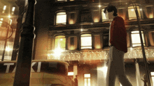 a man in a red sweater is walking down a street