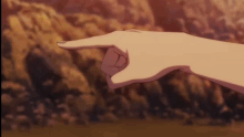 a close up of a person 's finger pointing at something