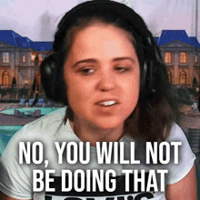 a woman wearing headphones has the words no you will not be doing that on her face