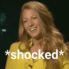 a woman in a yellow shirt has the word shocked written on her face