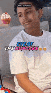 a man wearing an eye of the cupcake t-shirt