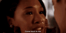 a close up of a woman 's face with the words `` come back to me '' .