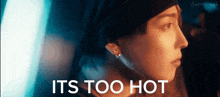 a close up of a person with the words it 's too hot