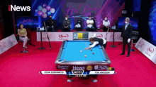 a pool table with a sign that says inews