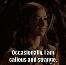 a woman in a dark room says occasionally i am callous and strange