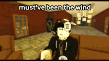 a cartoon character is sitting on a couch with the words must ve been the wind above him