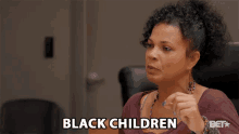 a woman says " black children " in a bet ad