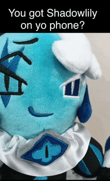 a stuffed animal with the words " you got shadowlily on yo phone " on the bottom