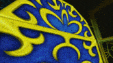 a blue background with yellow swirls and a heart