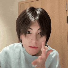a close up of a person 's face with aa + gif written on the bottom right