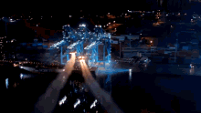 a blurry picture of a person 's hands in the air with a city in the background