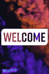a sign that says welcome with purple and orange smoke in the background
