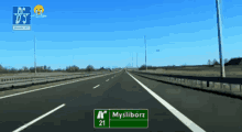 a highway with a green sign that says mysliborz 21