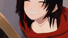 a girl with a red scarf around her neck smiles with her eyes closed