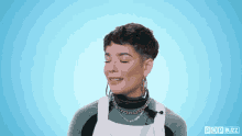 a woman with her eyes closed and a pop buzz logo in the corner