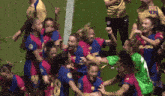 a group of female soccer players are celebrating on the field and one of them has the number 18 on her jersey