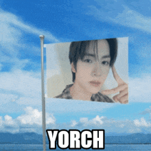 a flag with a picture of a man on it and the word yorch below it
