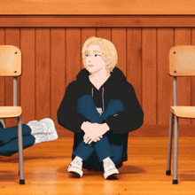 a girl sits on the floor with her legs crossed