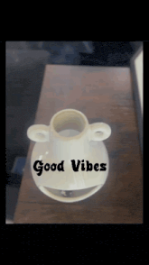 a picture of a vase that says good vibes