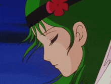 a cartoon girl with green hair and a red flower in her hair
