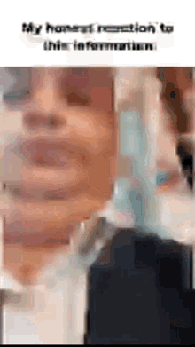 a close up of a person 's face with the words `` my honest reaction to this information '' .