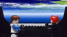 two lego figures are standing next to each other in front of a blue sky
